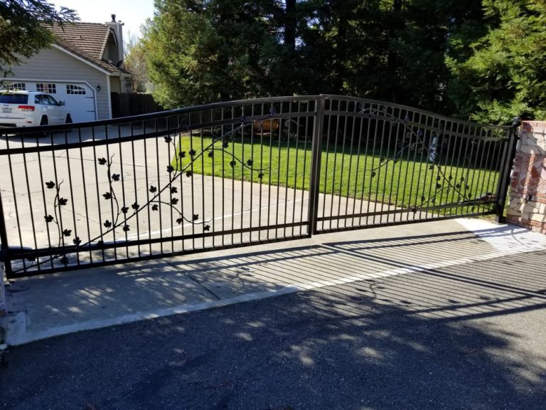 Custon iron driveway gate with vine detailing
